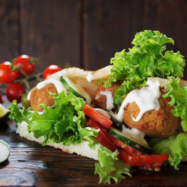 homemade falafel and fresh vegetables in pitta bread